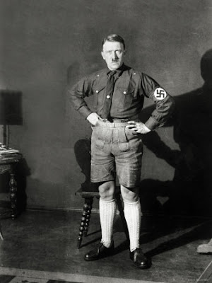 adolf-hitler-poised-hands-on-hips-sporting-lederhosen-and-shirt-with-swastika-arm-patch.jpg